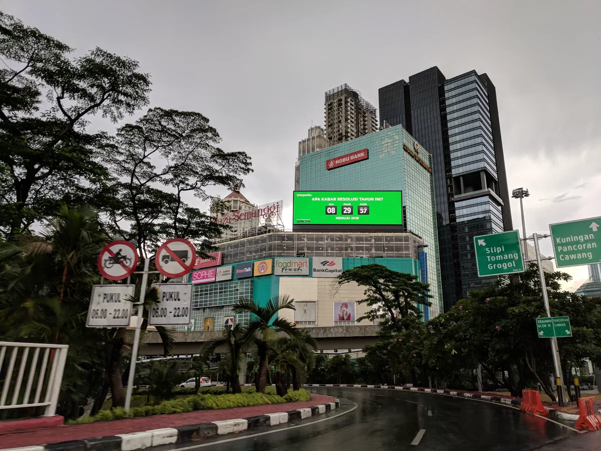 Large LED billboard on a building showing a live New Year countdown